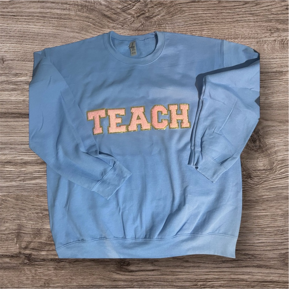 Blue Sweatshirt with 'TEACH' Embroidery